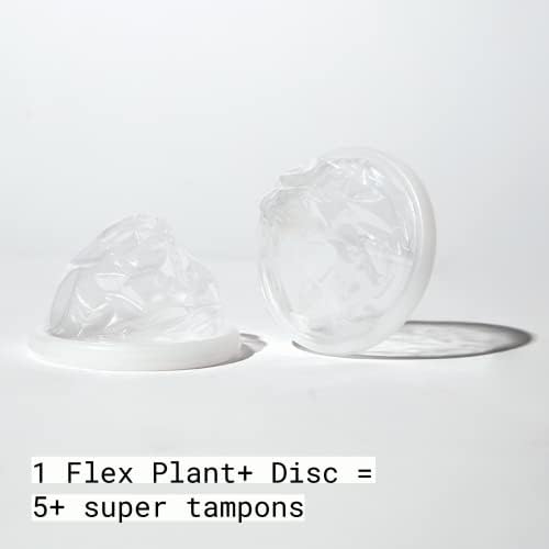 Disposable plant-based menstrual disc being pinched for easy insertion using the flexible rim.