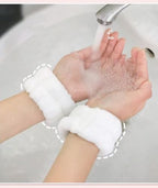 Set of two pairs of white wristbands for beauty care