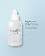 Complete Saalt period travel kit components including bag and sanitizer cup.