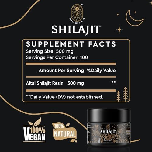 Close up view of authentic Altay Mummiyo shilajit paste being measured with a wooden spoon