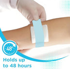 Demonstration of the painless removal process of the hypoallergenic blue skin tape.