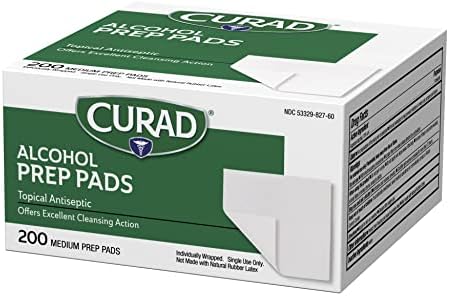 Individually wrapped Curad 2-ply alcohol swabs showing sterile packaging details.