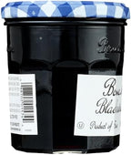Close-up view of the nutritional labels and natural ingredients list on the back of the Bonne Maman jelly glass jar