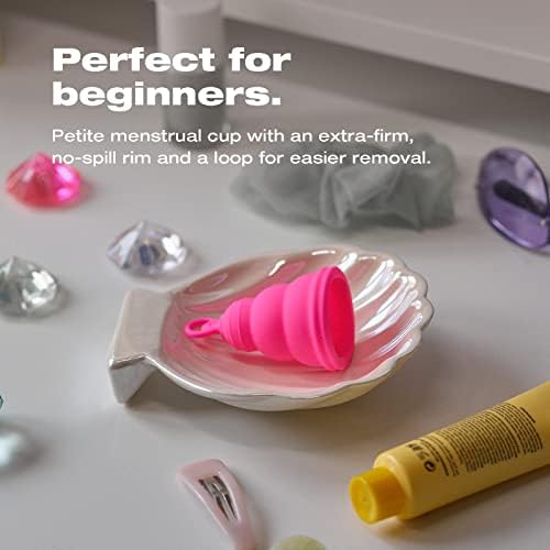 Intimina Lily Cup One folded flat inside its compact pink protective travel case.