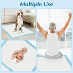 Extra large dog pee pads placed on a living room floor for puppy housebreaking training