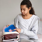 Compact blue travel bag for inhaler spacers and emergency medicine.