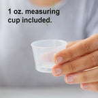 Close up view of the one ounce measuring cap on top of the imported liquid calcium bottle.