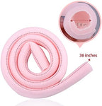 Pink tubular foam toe protector being cut with scissors for custom fit.