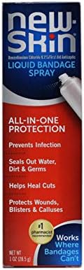 Five canisters of New-Skin liquid spray bandage arranged neatly to display the waterproof product label.