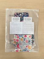 Soft fabric Mumufy urostomy bag protector wrap being adjusted for daily use.