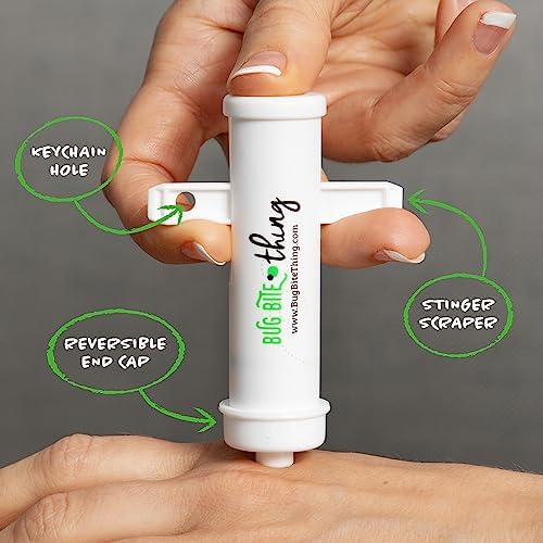 Compact Bug Bite Thing insect sting relief tool placed next to a travel first aid kit.