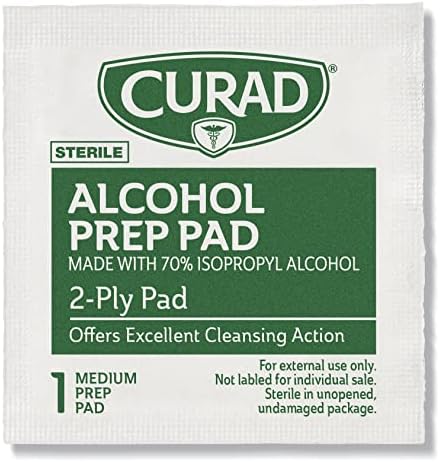 Curad sterile antiseptic wipes being removed from foil packet for skin preparation.