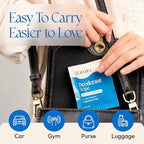Hand holding a FOMIN travel size deodorant wipe sachet demonstrating portable size.