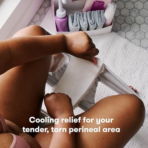 Frida Mom cooling pad liners being placed in a refrigerator for cold therapy.