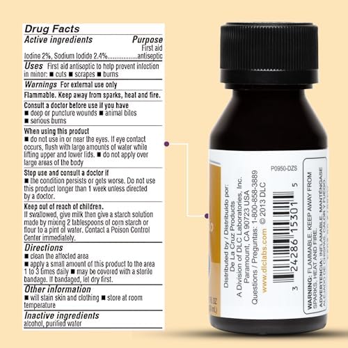 De La Cruz iodine solution bottle held in hand for scale
