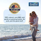 OmniBlue ocean minerals supplement being dropped into a fresh fruit smoothie.