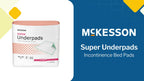 A single McKesson super underpad placed on a mattress to show product scale and bedside application.