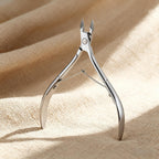 Generic professional cuticle trimmer front view showcasing sharp stainless steel jaw blades.