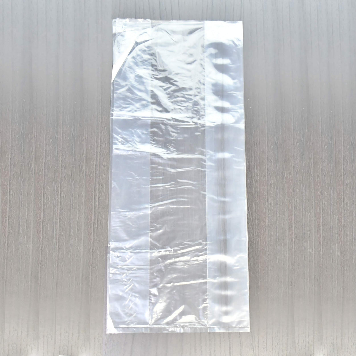 One size fits all transparent wax protectors showing the easy to separate opening design.