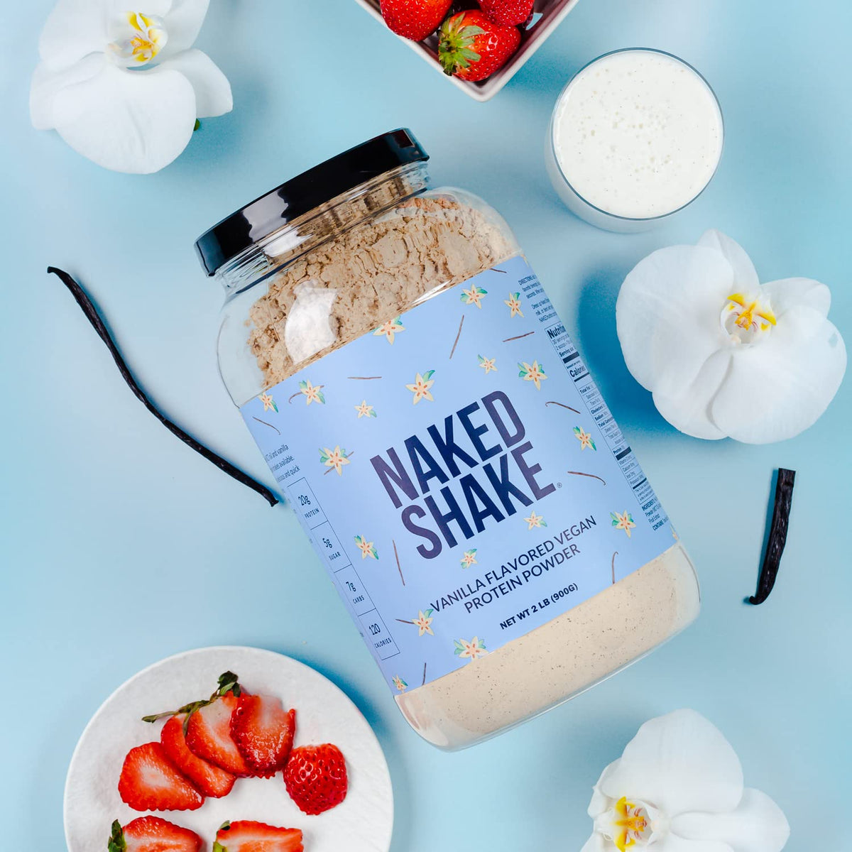 Vanilla plant based protein shake prepared in a glass with almond milk