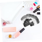 White fiberglass nail extension strips on hand