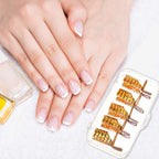 Hand wearing professional acrylic nail extension protector