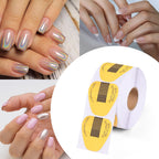 Professional nail technician using gold extension forms on fingers