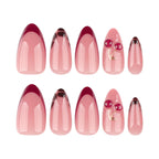 Close up of 3D cherry and gold branch details on Mivota almond nails