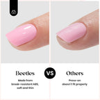 Hand wearing short almond press on nails from Beetles kit