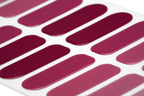 Gradient burgundy gel nail wraps with application file and cuticle stick accessories.