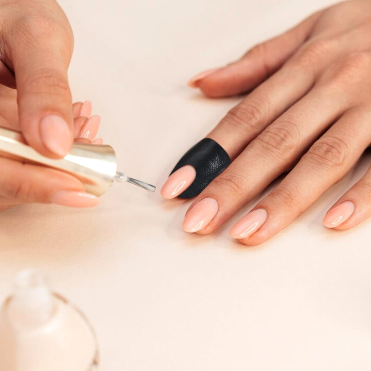 Skin friendly cuticle shield guards providing UV protection under a nail lamp