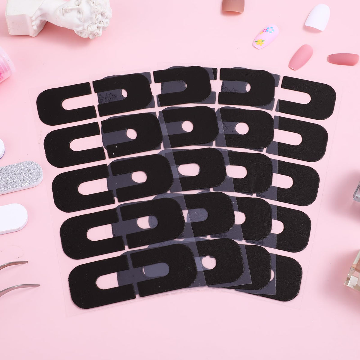 A multi-angle view of the one hundred and fifty piece nail paint guard kit for home styling.