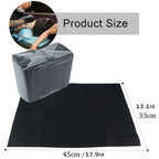 Black disposable dental bibs and nail mat paper sheets arranged on a clean professional salon table