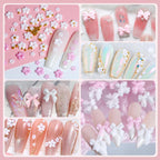 Model showing a finished manicure featuring pink acrylic flowers and cute bow nail art designs.