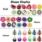Assorted miniature polymer fruit and flower slices spread out for detailed nail art inspiration.