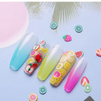 Non toxic colorful heart clay slices scattered on craft surface
