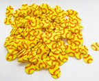 Close up of 5mm yellow softball clay sprinkles