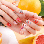 Manicure showcase featuring colorful miniature fruit slices embedded under a glossy gel topcoat
