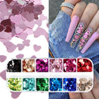 Close up of holographic heart nail art flakes
