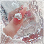 3D nail art decoration inspiration using white heart pearls