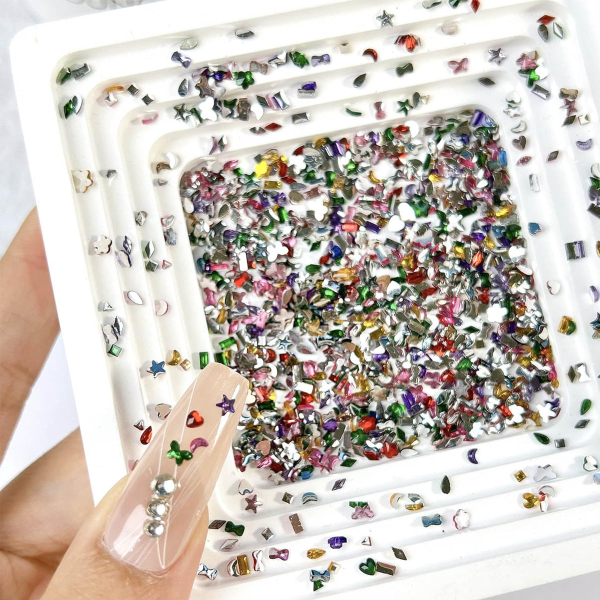 Close up of 3D multicolor heart and star nail rhinestones
