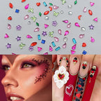 Hand model displaying intricate kawaii style nail art with crystal charms