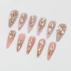 Professional nail art design using champagne gold rhinestones.