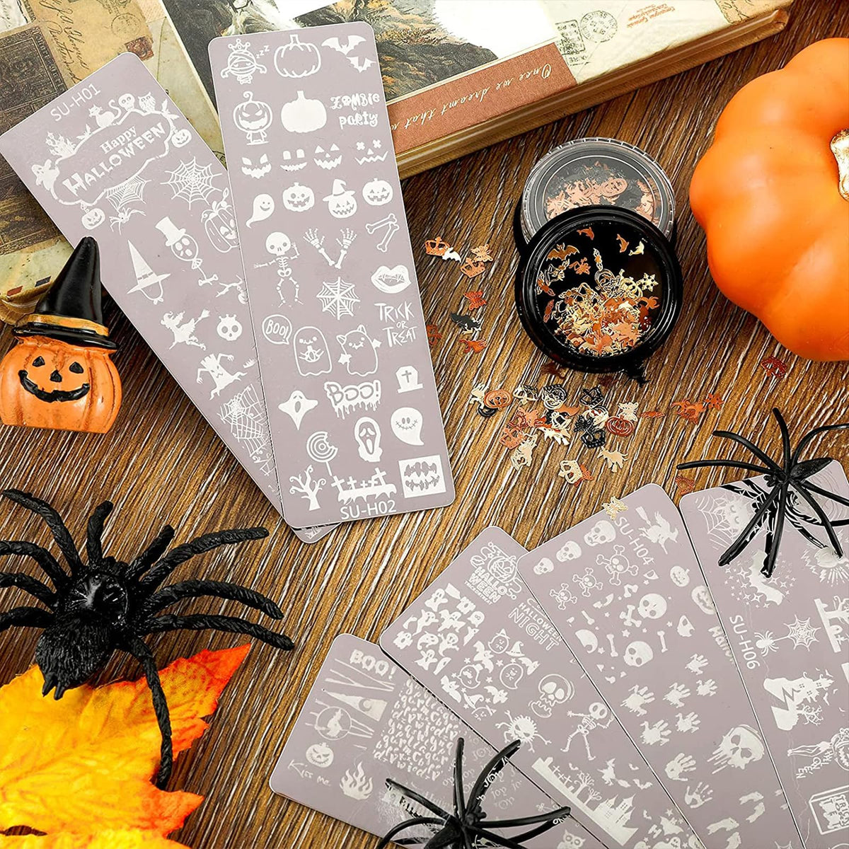 Detailed view of skull and spider web nail stamp patterns