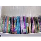 Professional nail art tools including gold and silver striping tape