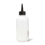 Salon Care applicator bottle being used for hair root treatment