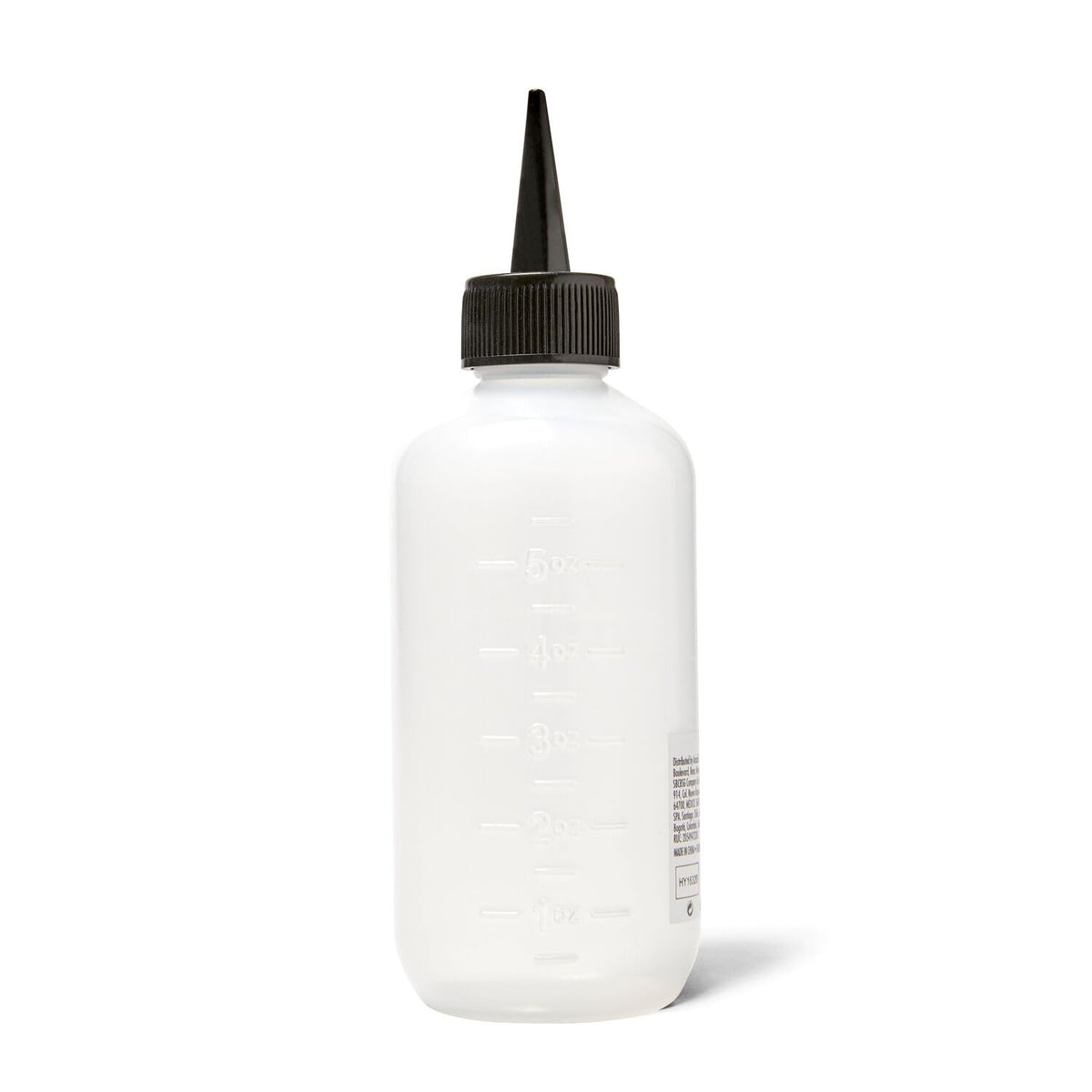Salon Care applicator bottle being used for hair root treatment