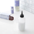 Top view of Salon Care narrow tip nozzle and cap