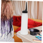 Comair Germany shampoo pump bottles displaying the leak proof pointed beak mouth closure.