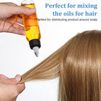 Side view of the flexible four ounce hair oil container being squeezed to demonstrate controlled fluid dispensing